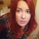 A pretty Eastern-European girl with red-dyed hair records herself taking a loud, soft, wet-sounding shit and a piss while sitting on a public restroom toilet. Presented in 720P HD. About 3.5 minutes.